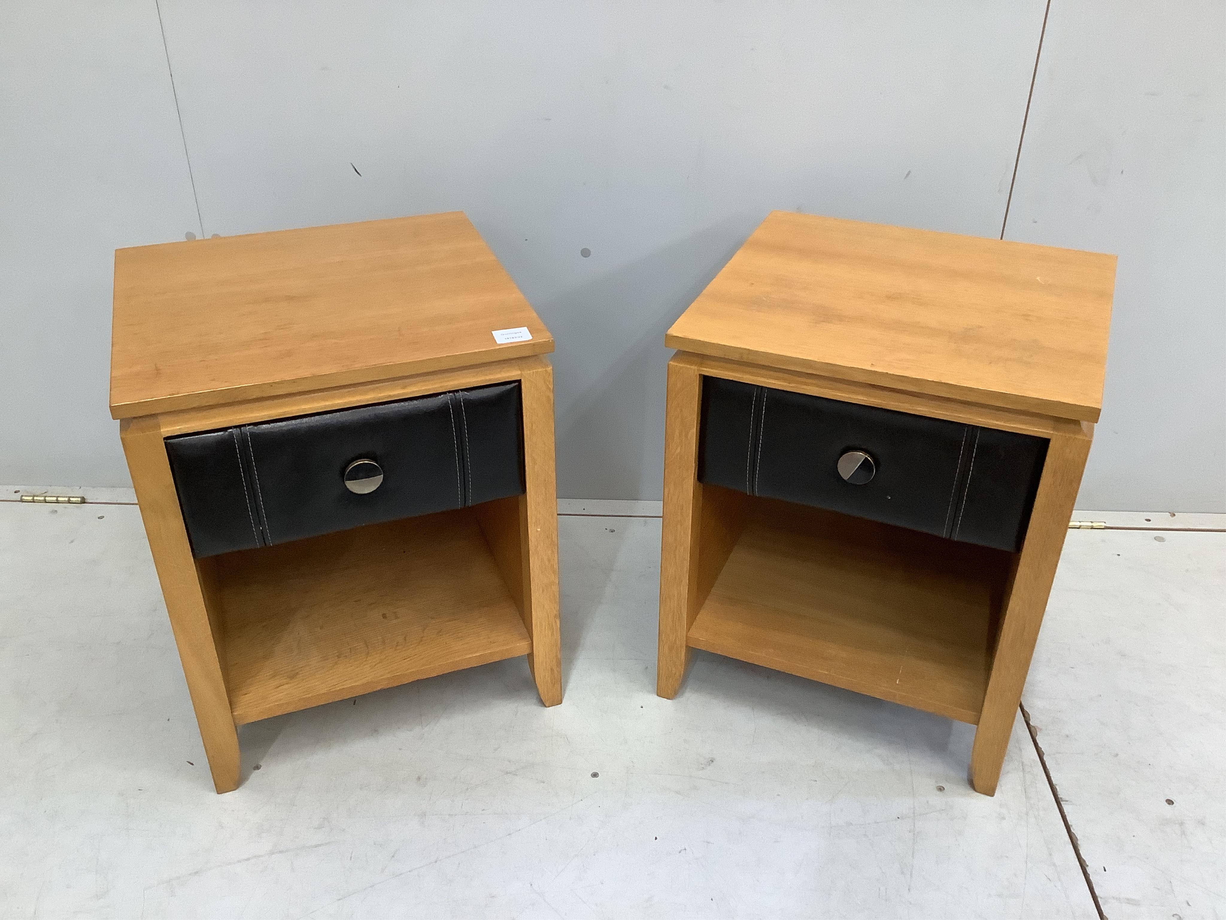 A pair of oak and tan leather bedside cabinets, width 45cm, depth 44cm, height 56cm